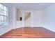 Hardwood floors and arched doorways create an inviting atmosphere within this spacious living area at 18126 Kara Ct, Tampa, FL 33647