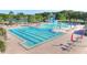 Aerial view of the sparkling community pool area with lap lanes, a water slide, and ample seating at 18126 Kara Ct, Tampa, FL 33647
