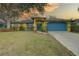 Charming single-Gathering home with a well-manicured lawn and inviting curb appeal at 1875 Oak Branch Dr, Sarasota, FL 34232
