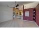 Spacious living area with tile flooring leading into the dining room at 1875 Oak Branch Dr, Sarasota, FL 34232
