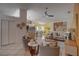 Bright living room and kitchen combo boasts an open floor plan and light tile flooring, creating an inviting space at 1875 Oak Branch Dr, Sarasota, FL 34232