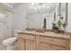 Comfortable bathroom featuring a light wood vanity, a toilet, and granite countertops at 1902 Sweet Bay Ct, Plant City, FL 33566