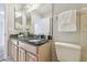 Bathroom features a granite countertop vanity, a mirror, and white towel at 1902 Sweet Bay Ct, Plant City, FL 33566