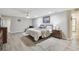 Large bedroom with wood floors, a ceiling fan, a plush bed, and natural light at 1902 Sweet Bay Ct, Plant City, FL 33566