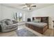 Bedroom with cozy furniture, a large window, and a wooden bed frame with storage at 1902 Sweet Bay Ct, Plant City, FL 33566