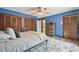 This bedroom features 3 closets, hardwood floors and a neutral color scheme at 1902 Sweet Bay Ct, Plant City, FL 33566