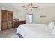 This bedroom has a ceiling fan and a closet at 1902 Sweet Bay Ct, Plant City, FL 33566