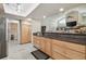 Kitchen with stainless appliances and granite countertop opens to a living area with a fireplace at 1902 Sweet Bay Ct, Plant City, FL 33566