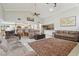 Expansive living room with high ceilings and tile floors is open to the kitchen, ideal for comfortable living and entertaining at 1902 Sweet Bay Ct, Plant City, FL 33566