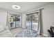 Sun room with pool views through sliding glass doors, perfect for indoor-outdoor living and relaxing by the pool at 1902 Sweet Bay Ct, Plant City, FL 33566