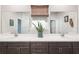 Modern bathroom showcasing double vanity, ample counter space, and elegant fixtures at 20237 Bandera Pl, Venice, FL 34293
