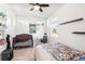 Bright bedroom with a crib, desk, and single bed, offering versatility and comfort at 20237 Bandera Pl, Venice, FL 34293