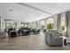 Open floor plan with dark dining furniture and large windows at 20237 Bandera Pl, Venice, FL 34293