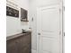 Neat entryway featuring storage cabinet, decorative wall art, and functional design at 20237 Bandera Pl, Venice, FL 34293