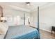 Spacious main bedroom featuring a four-poster bed, neutral color palette, and natural light at 20237 Bandera Pl, Venice, FL 34293