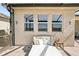 Cozy outdoor patio featuring a comfortable daybed and shaded seating area at 20237 Bandera Pl, Venice, FL 34293
