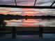Beautiful sunset over the pond with reflection, viewed from the pool area at 20237 Bandera Pl, Venice, FL 34293