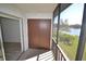 Balcony includes storage closet and entry, extending the living space with outdoor access at 256 Cypress Ln # 120, Oldsmar, FL 34677