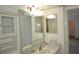 Bathroom with a mirror, sink, vanity and a window into the room next door at 256 Cypress Ln # 120, Oldsmar, FL 34677