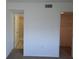 The entry to the bathroom features a shower and a closet at 256 Cypress Ln # 120, Oldsmar, FL 34677