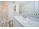 Bathroom featuring a shower, vanity, toilet, and marble countertop at 256 Cypress Ln # 120, Oldsmar, FL 34677