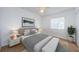 Bedroom decorated with a modern bed, stylish furniture, and neutral carpet at 256 Cypress Ln # 120, Oldsmar, FL 34677