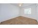 Bright and spacious bedroom with plush carpeting and natural light at 256 Cypress Ln # 120, Oldsmar, FL 34677