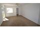 Bright bedroom featuring a ceiling fan, closet, and a window letting in natural light at 256 Cypress Ln # 120, Oldsmar, FL 34677