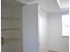 Bedroom walk-in closet with built-in shelving and bright natural light at 256 Cypress Ln # 120, Oldsmar, FL 34677