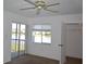Bedroom with window and sliding door with a view to the water at 256 Cypress Ln # 120, Oldsmar, FL 34677
