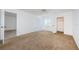 This bedroom has carpet, a window, a closet, and a sliding glass door at 256 Cypress Ln # 120, Oldsmar, FL 34677