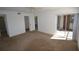 This bedroom has carpet, a closet, a sliding glass door to the patio, and a ceiling fan at 256 Cypress Ln # 120, Oldsmar, FL 34677