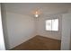 Bedroom with neutral carpet, window with blinds, ceiling fan, and closet at 256 Cypress Ln # 120, Oldsmar, FL 34677