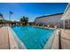 Community pool with lounge chairs and an American flag for neighborhood recreation at 256 Cypress Ln # 120, Oldsmar, FL 34677
