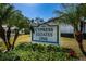 Cypress Estates One community sign surrounded by lush landscaping at 256 Cypress Ln # 120, Oldsmar, FL 34677