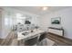 Dining area with elegant furniture and an open view into the modern kitchen at 256 Cypress Ln # 120, Oldsmar, FL 34677