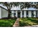 Well-maintained condo building with mature trees and green lawn, located at 3435 Cove Isle Dr #256, Tampa, FL at 256 Cypress Ln # 120, Oldsmar, FL 34677