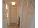 Hallway with closet and view to bathroom and bedroom at 256 Cypress Ln # 120, Oldsmar, FL 34677
