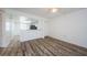 Open floor plan featuring a kitchen and living area with laminate floors at 256 Cypress Ln # 120, Oldsmar, FL 34677