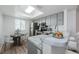 Bright kitchen features stainless steel appliances, marble countertops, and a skylight at 256 Cypress Ln # 120, Oldsmar, FL 34677