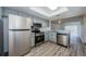 Open kitchen featuring stainless steel appliances and sightlines to the living area at 256 Cypress Ln # 120, Oldsmar, FL 34677