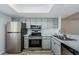 Updated kitchen featuring stainless steel appliances and marble countertops at 256 Cypress Ln # 120, Oldsmar, FL 34677