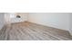 Open floor plan with wood grain floors and views of the kitchen at 256 Cypress Ln # 120, Oldsmar, FL 34677