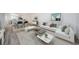 A sun filled staged living room provides open concept and comfy elegance at 256 Cypress Ln # 120, Oldsmar, FL 34677