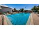 Inviting community pool with clear blue water and plenty of lounge seating at 256 Cypress Ln # 120, Oldsmar, FL 34677