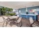 Community pool area with a table, chairs, and a covered seating area at 256 Cypress Ln # 120, Oldsmar, FL 34677