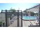 Gated community pool with lounge chairs surrounded by lush landscaping at 256 Cypress Ln # 120, Oldsmar, FL 34677