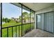 Enjoy the views of the lake from the screened in balcony at 256 Cypress Ln # 120, Oldsmar, FL 34677