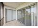 Screened balcony with tiled floor and sliding glass door access at 256 Cypress Ln # 120, Oldsmar, FL 34677