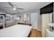 Spacious bedroom featuring a TV, closet, and access to the bathroom at 2731 Sherbrooke Ln # D, Palm Harbor, FL 34684